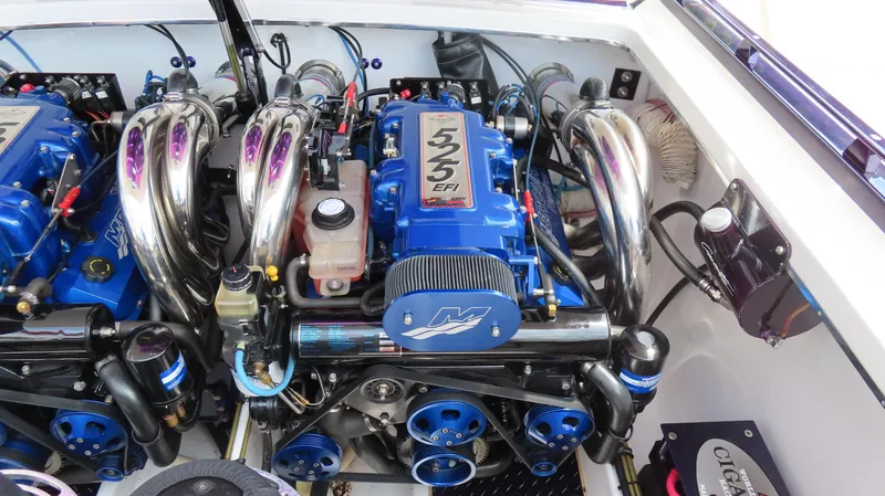 Slide: The Image of Engine compartment of a 2005 Cigarette 38 Top Gun boat, featuring dual 525 EFI engines. - 9