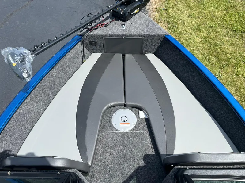 Slide: The Image of 2026 Lund 1775 Adventure Sport boat interior with gray and black seating, blue trim. - 10