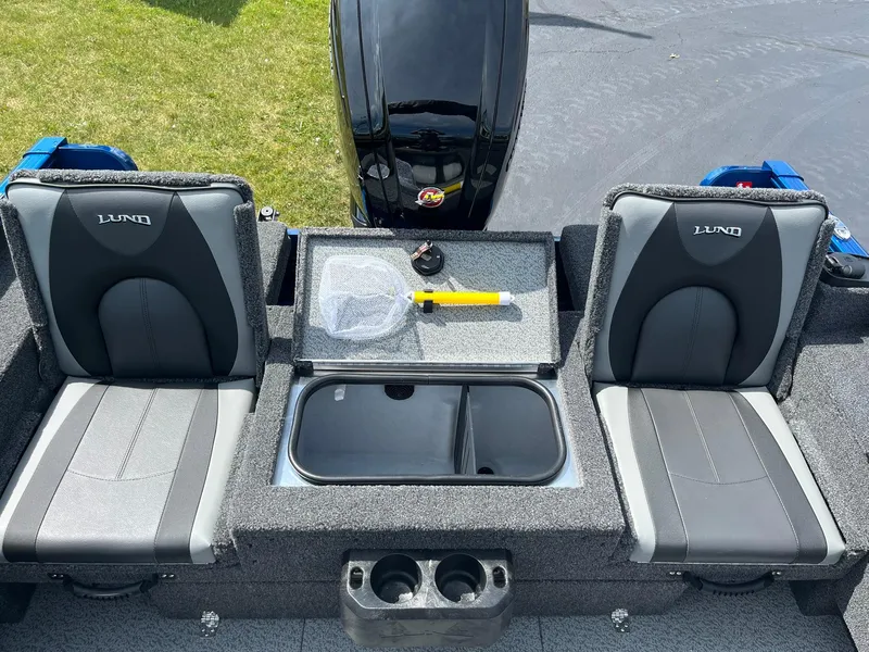 Slide: The Image of 2026 Lund 1775 Adventure Sport boat interior with two seats and storage compartment. - 15