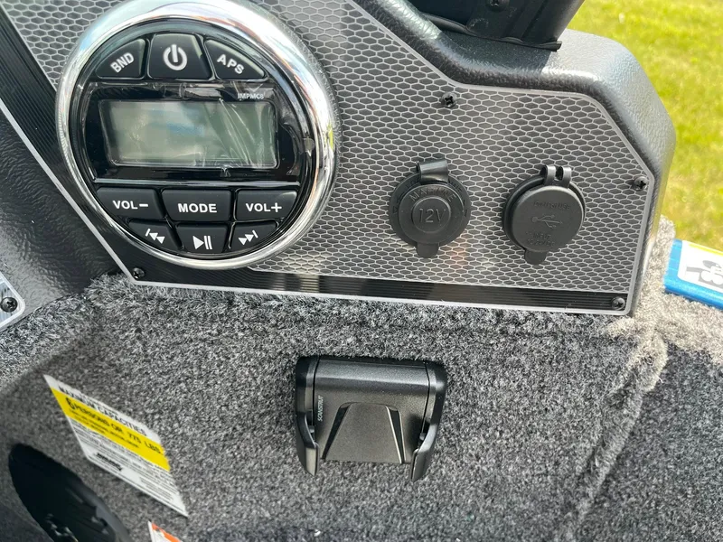 Slide: The Image of Control panel of 2026 Lund 1775 Adventure Sport boat with audio and charging ports. - 16