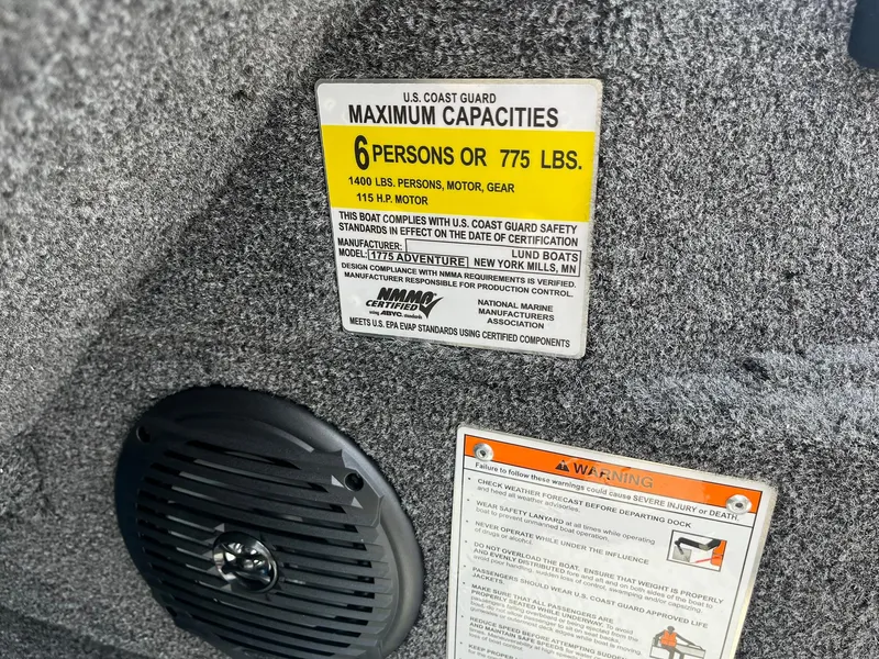 Slide: The Image of 2026 Lund 1775 Adventure Sport capacity label, indicating maximum 6 persons or 775 lbs. - 18