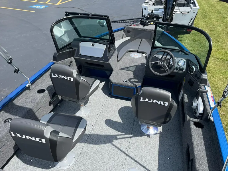 Slide: The Image of 2026 Lund 1775 Adventure Sport boat interior with seating and dashboard. - 4