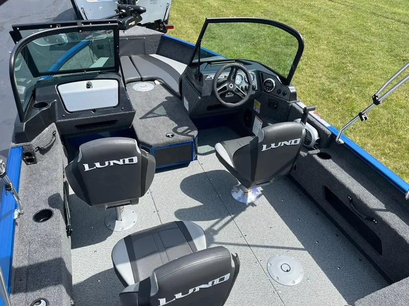 Slide: The Image of 2026 Lund 1775 Adventure Sport boat interior with seating and steering console. - 5