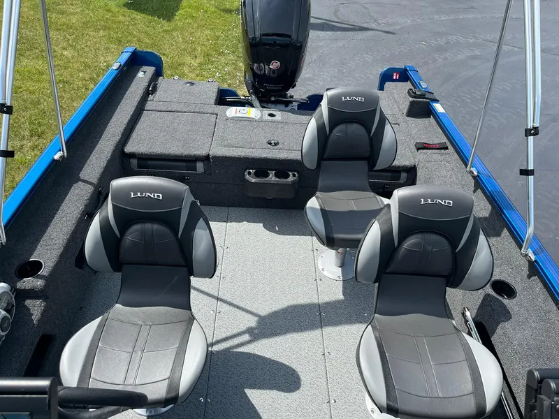 Slide: The Image of 2026 Lund 1775 Adventure Sport boat interior with three cushioned seats. - 6