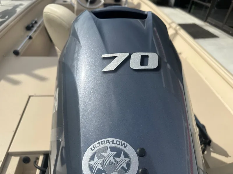 Slide: The Image of 2024 G3 Bay 17 boat engine with "70" and "Ultra-Low" emblem. - 6