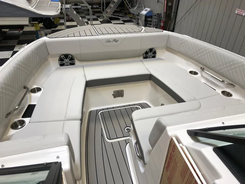 Slide: The Image of 2025 Sea Ray SDX 270 boat interior with white seating and modern design. - 8