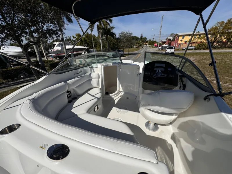 Slide: The Image of 2017 Hurricane 2000SD boat interior with white seating and steering console. - 14