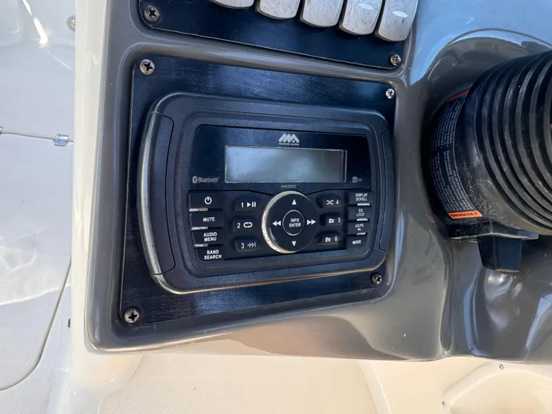 Slide: The Image of Boat stereo system on 2017 Hurricane 2000SD, featuring Bluetooth and audio controls. - 20