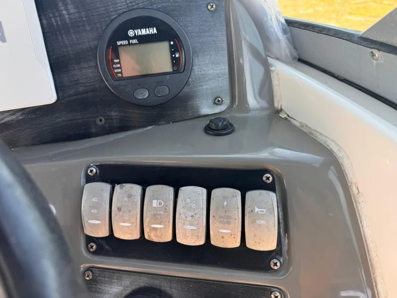 Slide: The Image of Control panel of a 2017 Hurricane 2000SD boat with Yamaha speed fuel gauge. - 22