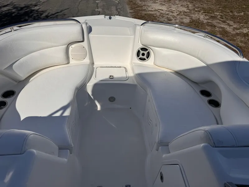 Slide: The Image of 2017 Hurricane 2000SD boat interior with white seating and cup holders. - 24