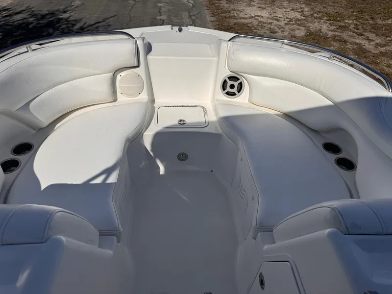 Slide: The Image of 2017 Hurricane 2000SD boat interior with white seating and cup holders. - 25