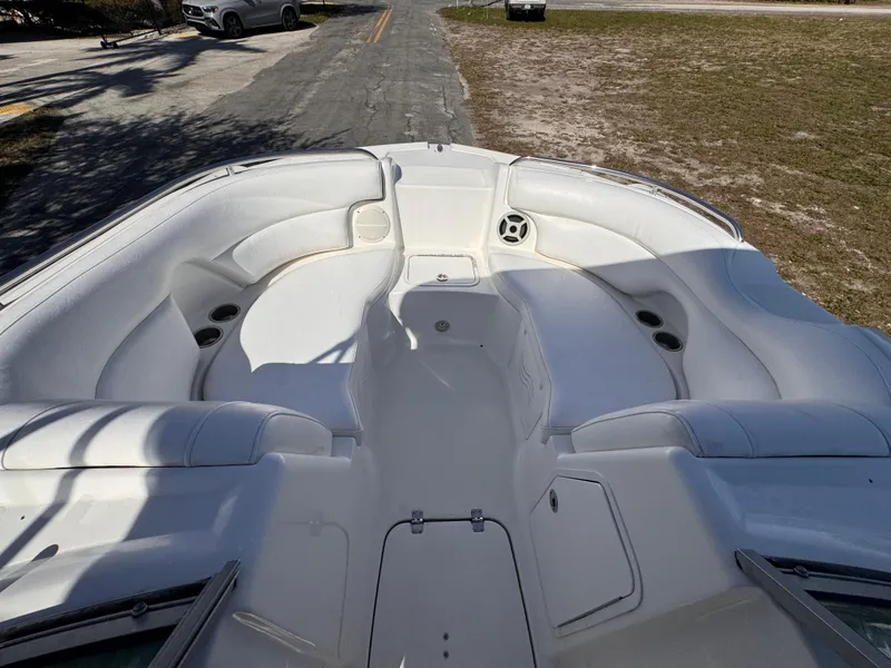Slide: The Image of Bow seating area of a 2017 Hurricane 2000SD boat, featuring white cushioned seats. - 26