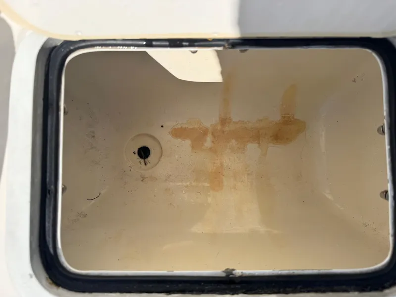 Slide: The Image of Open storage compartment of a 2017 Hurricane 2000SD boat, showing interior stains. - 27