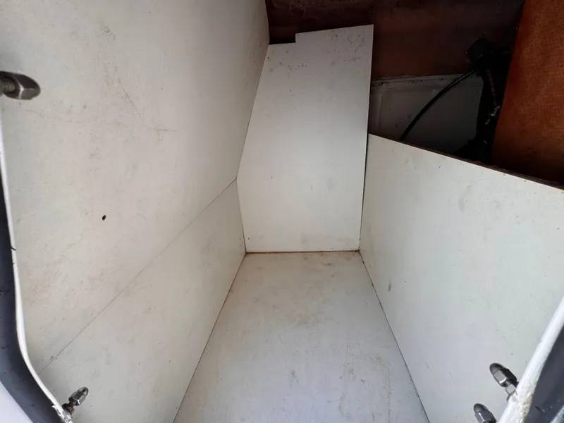 Slide: The Image of Empty storage compartment of a 2017 Hurricane 2000SD boat. - 38
