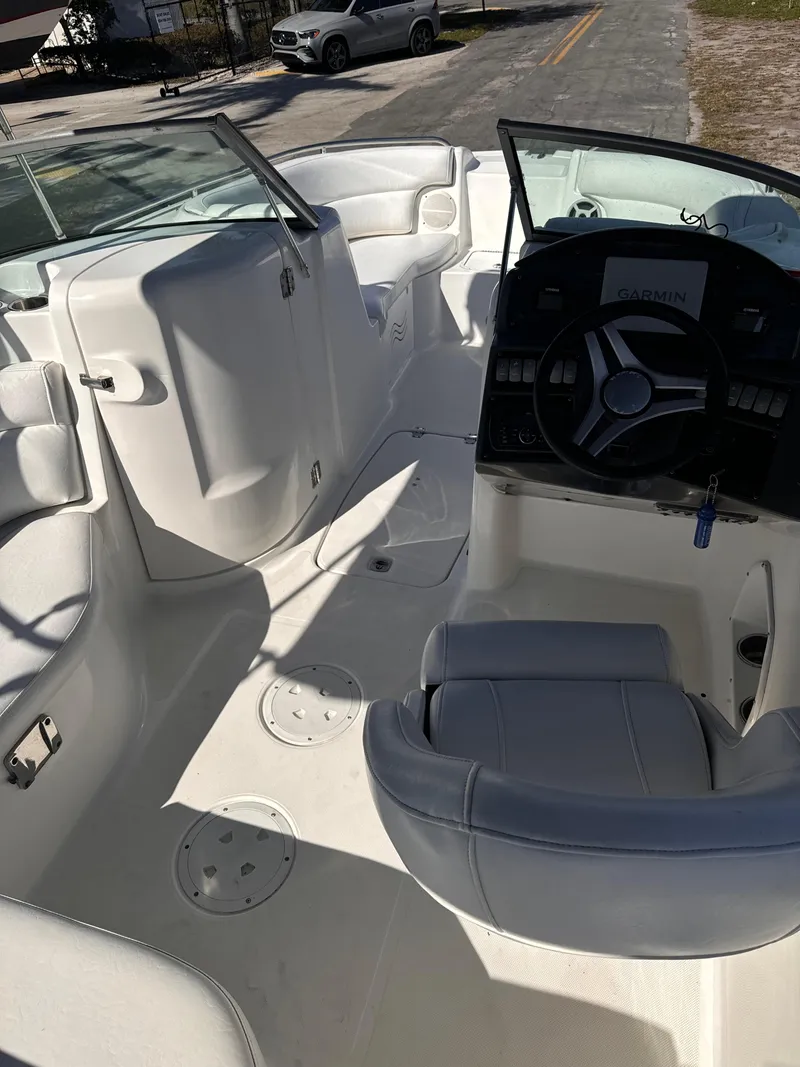 Slide: The Image of Interior of a 2017 Hurricane 2000SD boat with steering wheel and seating. - 40