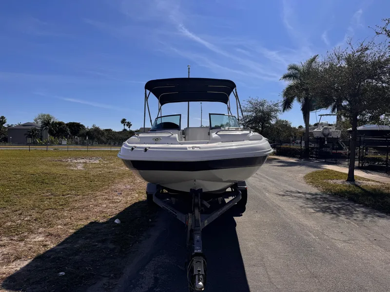 Slide: The Image of 2017 Hurricane 2000SD boat on trailer under clear blue sky. - 9