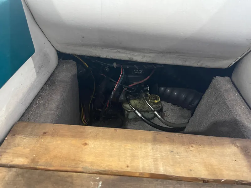 Slide: The Image of Engine compartment of a 1993 Regal 176 SE boat, showing wiring and components. - 16