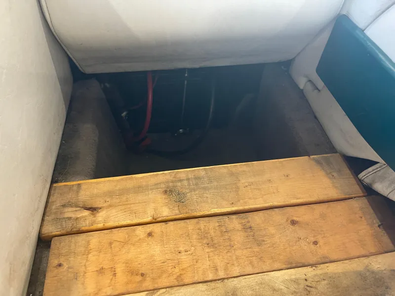 Slide: The Image of Wooden planks inside a 1993 Regal 176 SE boat interior. - 17