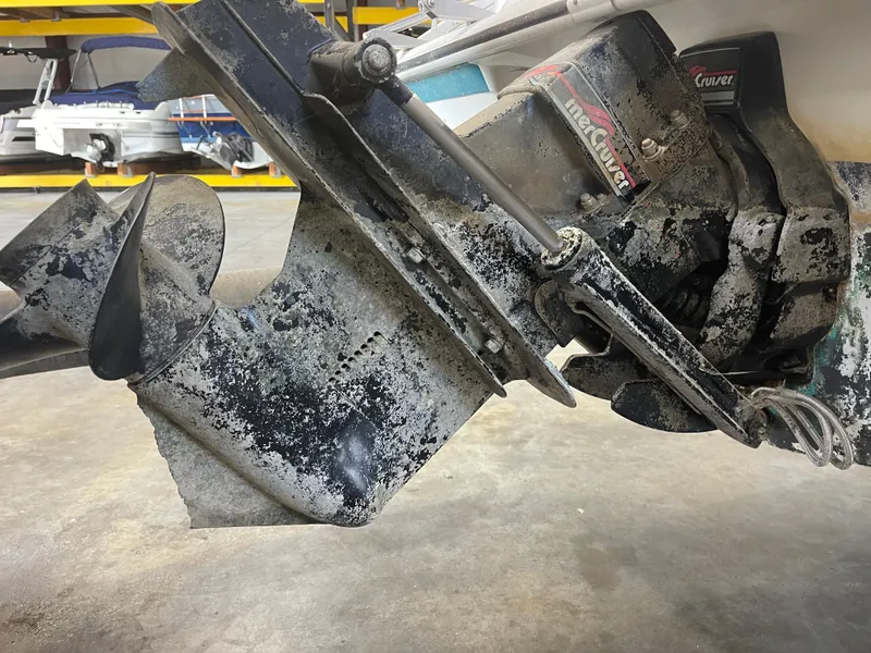 Slide: The Image of Close-up of a weathered 1993 Regal 176 SE boat engine in a storage facility. - 19