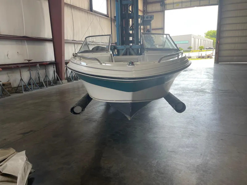 Slide: The Image of 1993 Regal 176 SE boat in a warehouse, front view. - 3