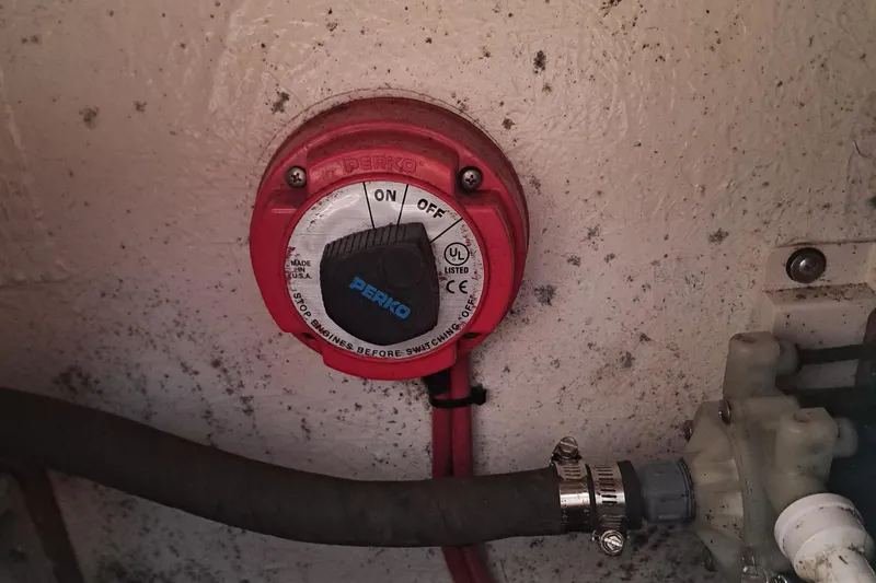 Slide: The Image of Red Perko battery switch on 2003 Carolina Classic 28 Express Sportfisherman boat. - 16