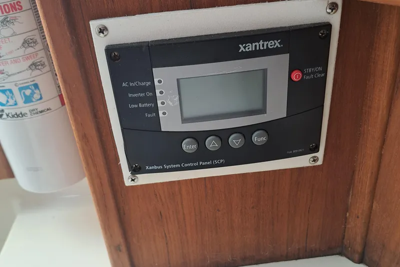 Slide: The Image of Xantrex control panel on 2003 Carolina Classic 28 Express Sportfisherman boat. - 18