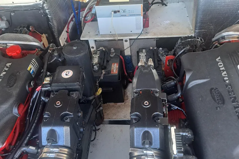 Slide: The Image of Engine compartment of a 2003 Carolina Classic 28 Express Sportfisherman with Volvo Penta engines. - 22