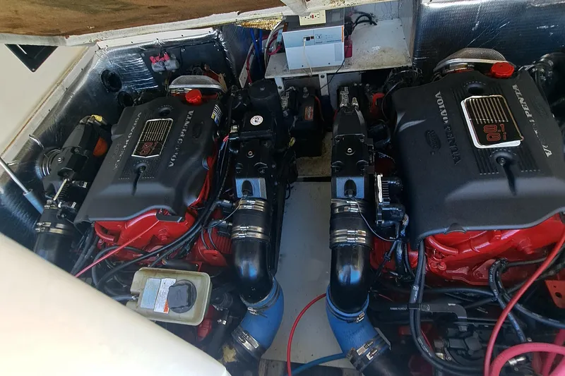 Slide: The Image of Engine compartment of a 2003 Carolina Classic 28 Express Sportfisherman with Volvo Penta engines. - 26