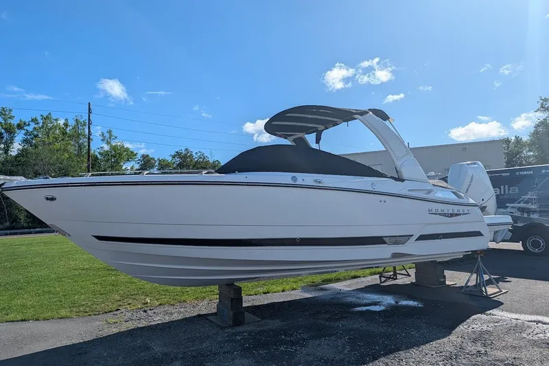 The Image of 2026 Monterey 275SS Super Sport boat on display under clear blue sky. - 0