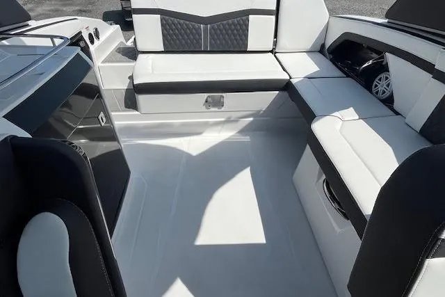 Slide: The Image of 2026 Monterey 275 Super Sport boat with powerful outboard motor, docked outdoors. - 12