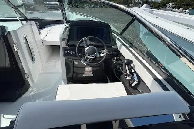 Slide: The Image of 2026 Monterey 275 Super Sport boat interior with sleek dashboard and modern steering wheel. - 4