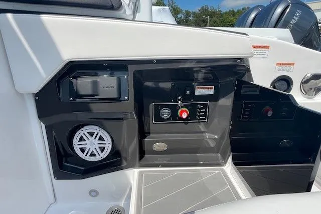 Slide: The Image of 2026 Monterey 275 Super Sport boat dashboard with control panel and speaker. - 6