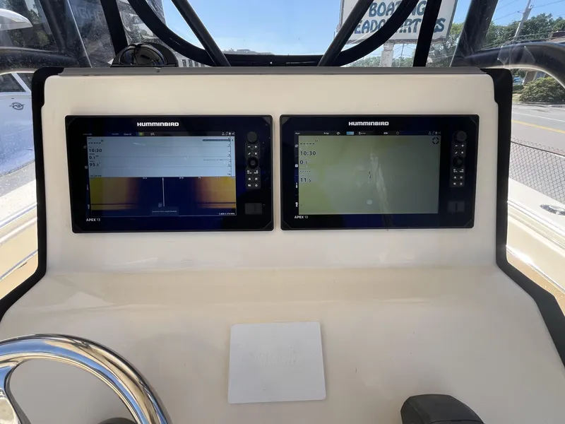 Slide: The Image of 2024 Jones Brothers Cape Fisherman 26 dashboard with dual Humminbird displays. - 9