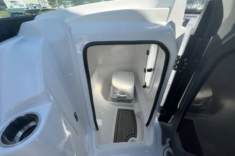 Slide: The Image of 2026 Monterey M-45 boat interior with compact marine toilet and sleek design. - 12