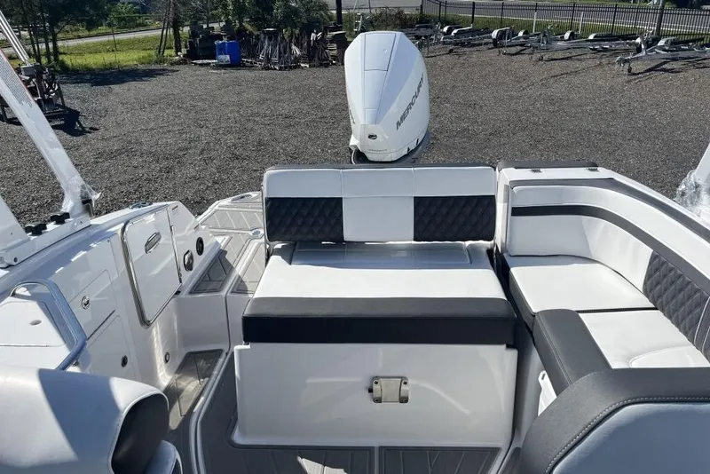 Slide: The Image of 2026 Monterey M-45 boat interior with white seating and Mercury outboard motor. - 7