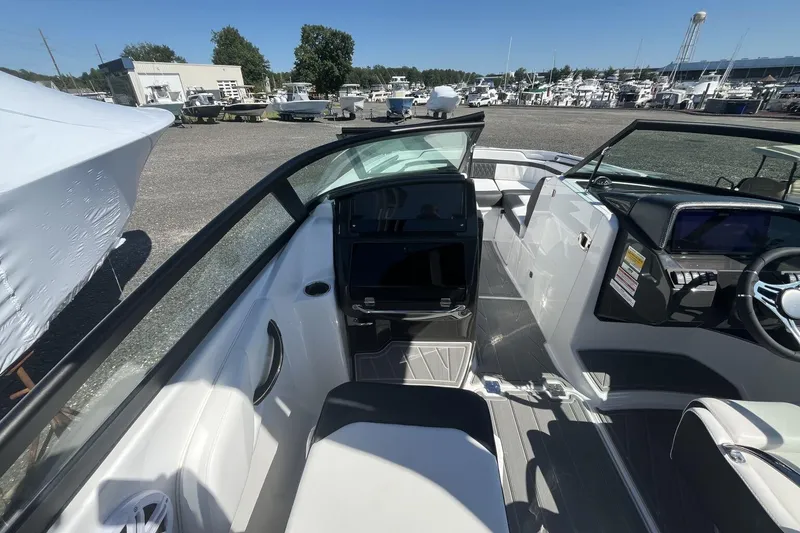 Slide: The Image of Interior view of a 2026 Monterey M-45 boat at a marina, showcasing sleek design and controls. - 8