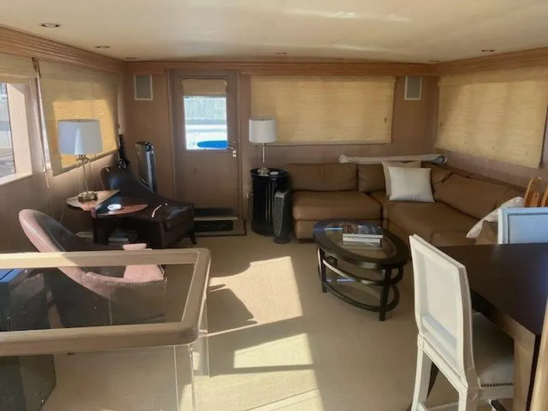 Slide: The Image of Luxurious interior of 1996 Hatteras 70 Sport Deck Motor Yacht with modern furnishings. - 12