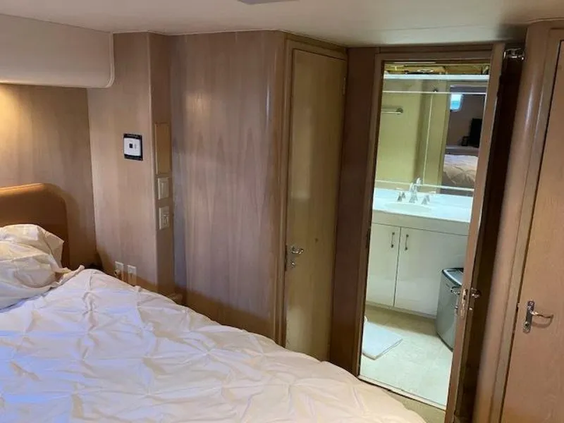 Slide: The Image of Bedroom and bathroom interior of 1996 Hatteras 70 Sport Deck Motor Yacht. - 38