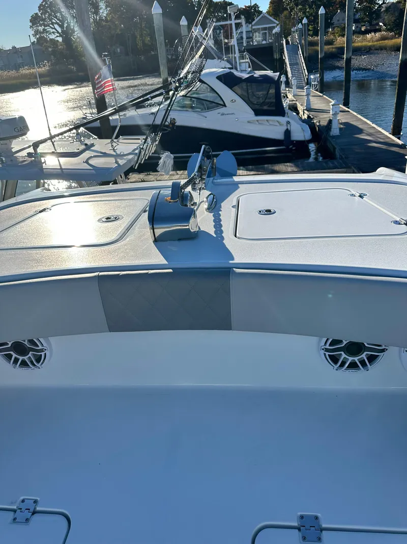 Slide: The Image of 2024 Wyatt and Freeman 42LR boat docked at marina with clear sky. - 9