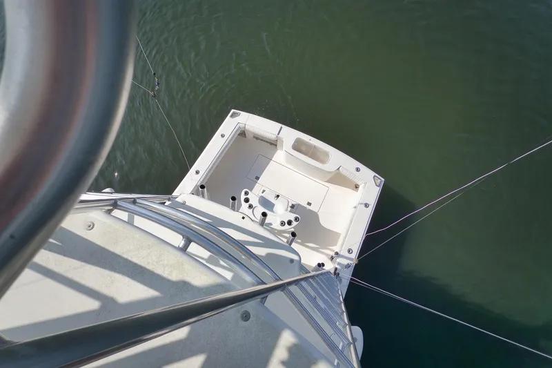 Slide: The Image of Aerial view of 2006 Cabo 32 Express boat deck on calm water. - 28
