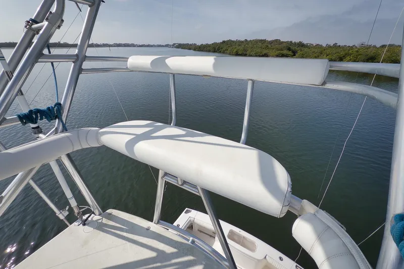 Slide: The Image of 2006 Cabo 32 Express boat tower overlooking calm waters and lush shoreline. - 27
