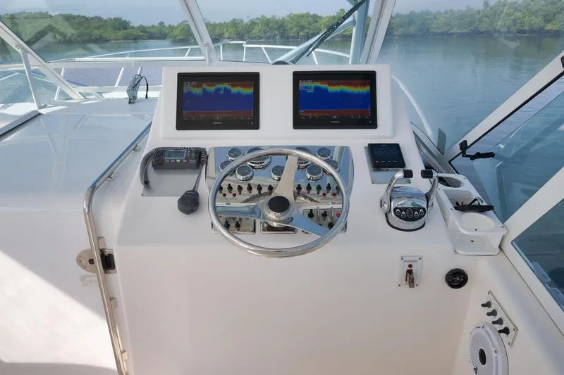 Slide: The Image of 2006 Cabo 32 Express helm with dual displays and navigation controls. - 22