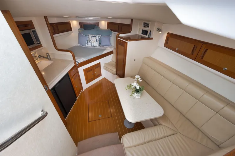 Slide: The Image of Luxurious interior of 2006 Cabo 32 Express yacht with cozy seating and modern amenities. - 29