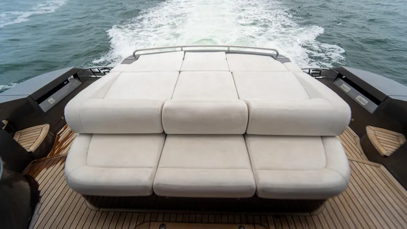 Slide: The Image of Luxury sunbed on 2009 Pershing 64 yacht, cruising through ocean waters. - 10