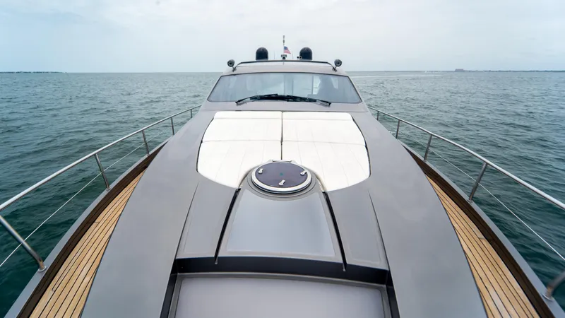 Slide: The Image of 2009 Pershing 64 yacht on open water, showcasing sleek design and luxury features. - 15