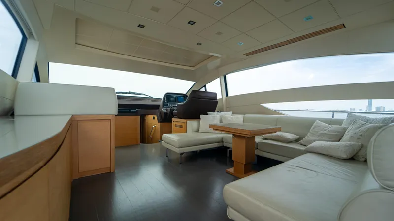 Slide: The Image of Luxurious interior of a 2009 Pershing 64 yacht with modern seating and helm. - 16