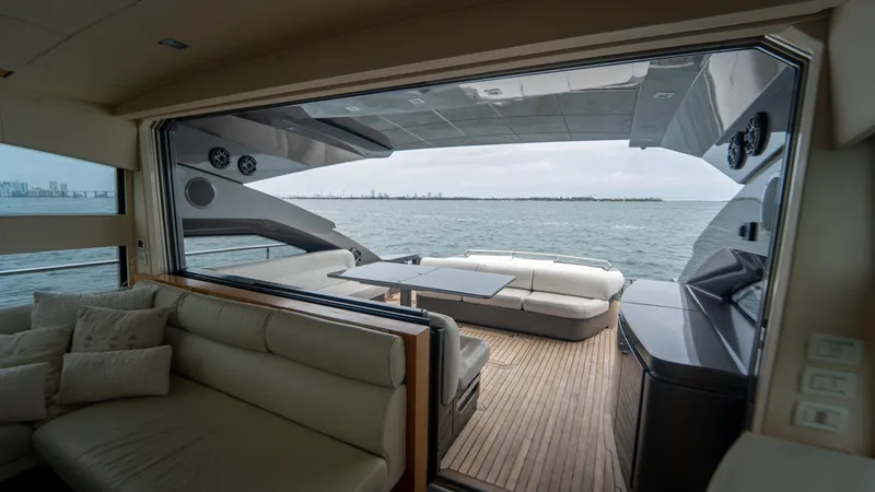 Slide: The Image of Luxurious interior view of a 2009 Pershing 64 yacht overlooking the ocean. - 17