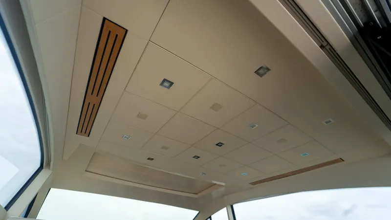 Slide: The Image of Ceiling interior of 2009 Pershing 64 yacht with modern lighting and design. - 20