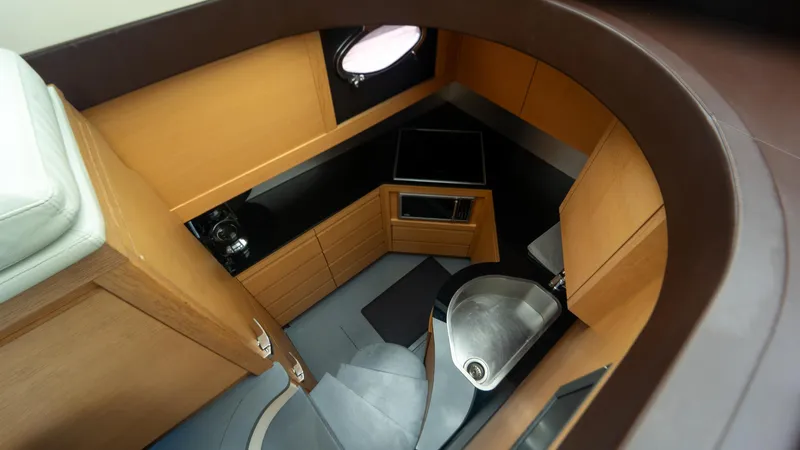 Slide: The Image of Interior of 2009 Pershing 64 yacht, featuring modern kitchen and sleek design elements. - 21