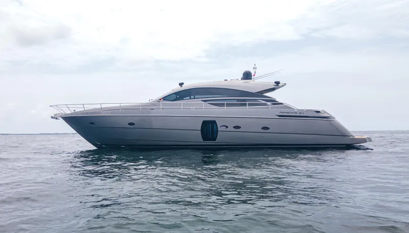 Slide: The Image of 2009 Pershing 64 yacht on calm sea under cloudy sky. - 4